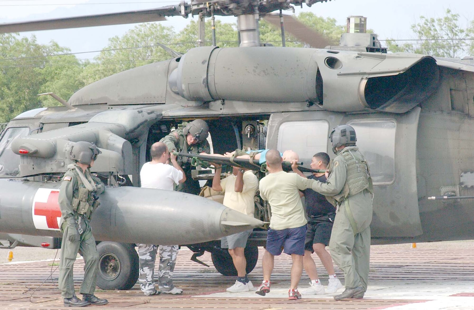Soto Cano Air Base's Medical Element hosted training for members from the U.S. Embassy and local healthcare providers the week of April 16-20. The 1-228th Aviation Regiment landed medical evacuation helicopters on the base helipad so the visiting healthcare workers could practice proper litter loading procedures in case of a medical evacuation emergency. (Photo by U.S. Air Force Staff Sgt. Chyenne A. Griffin)     