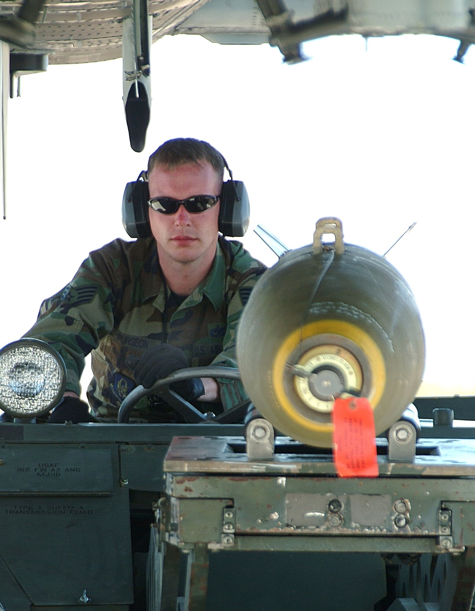 Staff Sgt. Stephen Spurgeon drives a jammer with a 500-pound bomb for loading on an A-10 Thunderbolt II at Davis Monthan Air Force Base, Ariz., during his unit's "Patriot Rattlesnake" deployment. Reservists from the 442nd Fighter Wing deployed to Arizona from Whiteman AFB, Mo., to practice employing live munitions on the Barry M. Goldwater Range. Sergeant Spurgeon is assigned to the 442nd Aircraft Maintenance Squadron. (U.S. Air Force photo/Master Sgt. Bill Huntington) 