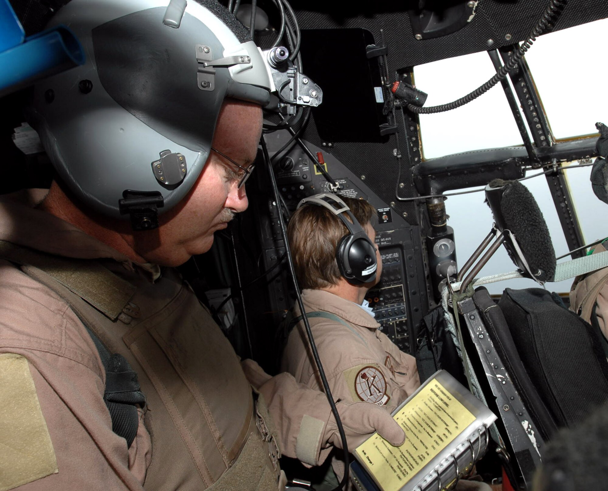 Senior Master Sgt. Steve Lacy runs a checklist while flying in a HC-130 aircraft as part of a Combined Joint Task Force - Horn of Africa mission April 14. Sergeant Lacy is deployed to Africa from the 39th Combat Rescue Squadron at Patrick Air Force Base, Fla. Combined Joint Task Force - Horn of Africa is a unit of the U.S. Central Command. The organization's mission is to prevent conflict, promote regional stability and protect coalition interests in order to prevail against extremism. (U.S. Air Force photo/Tech. Sgt. Lee Harshman)