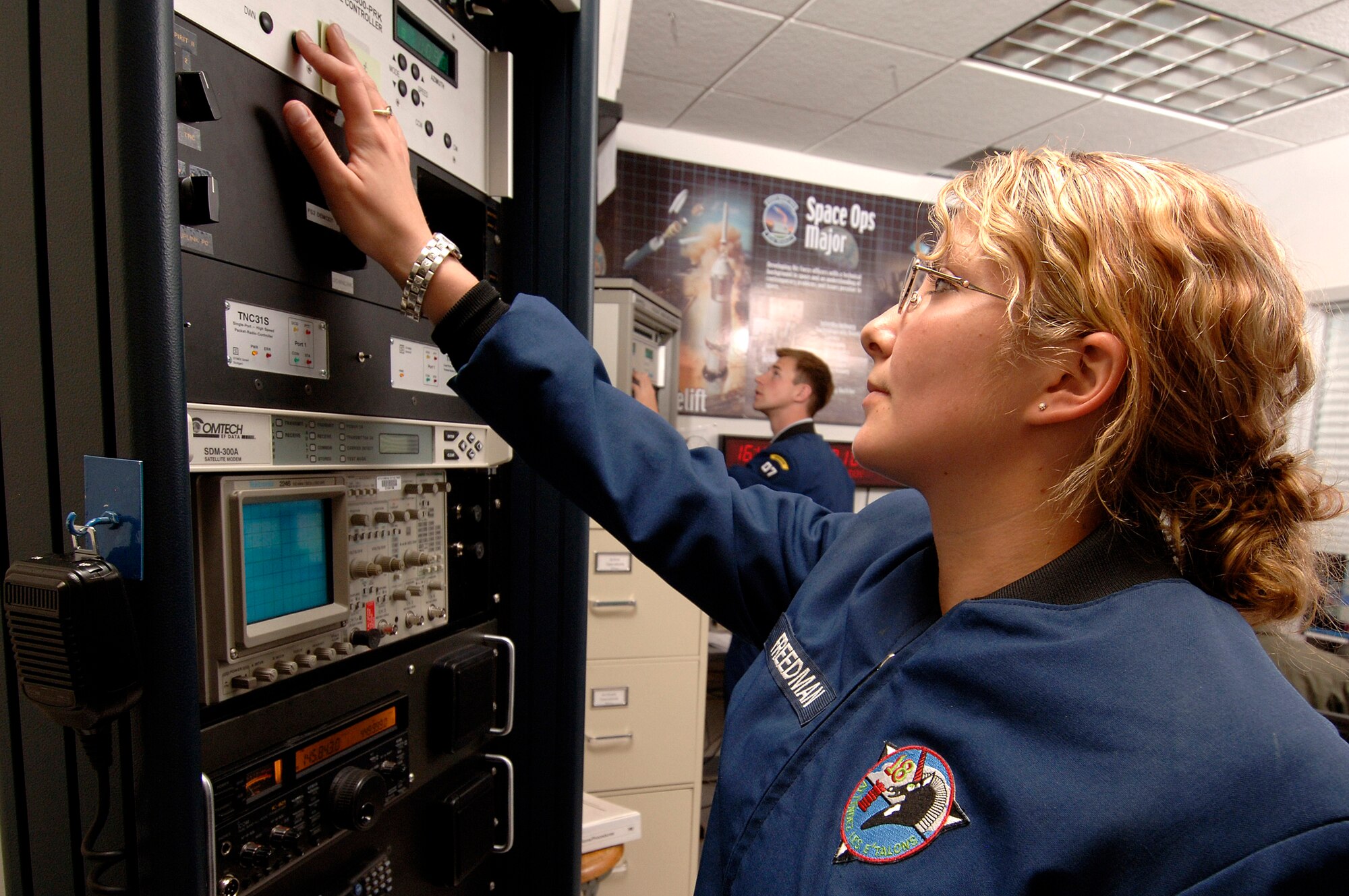Senior cadet Charlette Freedman configures the ground station antenna's into the right location for the next pass of Falcon Satellite-3 at the U.S Air Force Academy, Colo. The satellite was designed and built, by Academy cadets who now test and operate it. The project is administered by the USAFA Space Systems Research Center. (U.S. Air Force photo/Mike Kaplan)