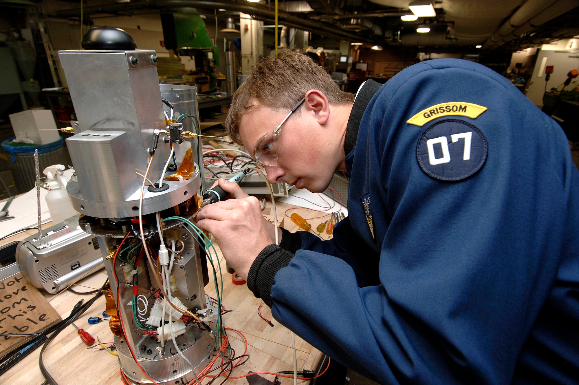 Senior cadet Harrison Sumerall performs the last electrical test on the Falcon Launch-5 avionics case April 12 at the U.S. Air Force Academy in Colorado Springs, Colo. The satellite is being designed and built by Academy cadets. It will be tested and operated by the cadets through the USAFA Space Systems Research Center. (U.S. Air Force photo/Mike Kaplan)
