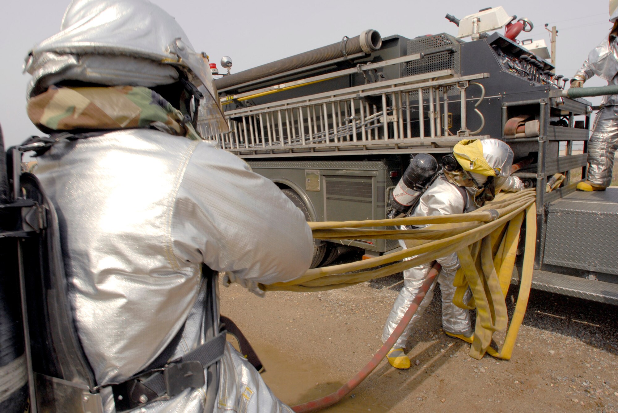 Firefighters from the 8th Civil Engineer Squadron respond to a simulated fire during an operational readiness inspection April 17 at Kunsan Air Base, South Korea. Kunsan AB is currently undergoing an operational readiness inspection to test the 8th Fighter Wing's ability to conduct its wartime mission. (U.S. Air Force photo/Senior Airman Barry Loo) 
