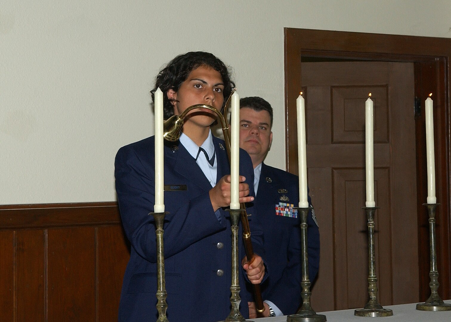 Airman Andrea Guidry lights a candle in remembrance of Holocaust victims during a special ceremony April 15 at the Airmen Memorial Chapel on Lackland Air Force Base, Texas. About 50 people attended the Holocaust Remembrance Service sponsored by the 37th Training Wing Chapel staff. (USAF photo by Alan Boedeker)                                 