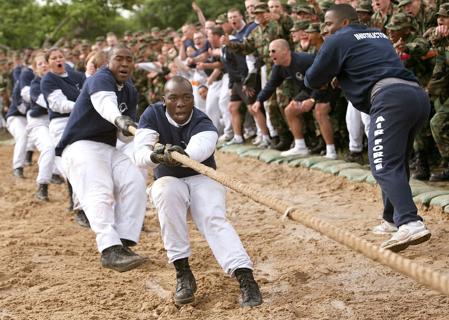 One last pull does the trick for the 326th Training Squadron during the April 14 Warrior Challenge tug-of-war competition at Lackland Air Force Base, Texas. Pictured front to back are: Airman Bryant Jenkins, Flight 261 graduate; Airman Edmond Prude, FLT 261 graduate; Trainee Audra Barnett, FLT 316 and Trainee Katherine Bouldin, FLT 316.  The 326th  TRS has won this event for the past five months. (USAF photo by Robbin Cresswell)