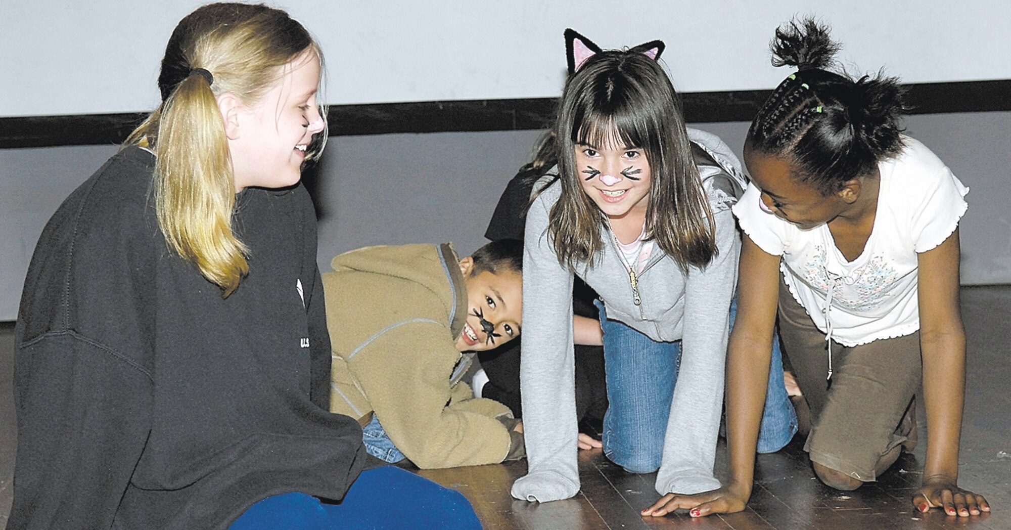 Children from Pope Elementary School put on a play called the Golden Ring at the base theater Monday at the volunteer appreciation luncheon. Pope's volunteers were recognized for a year of hard work. (Air Force photo/Mike Murchison)