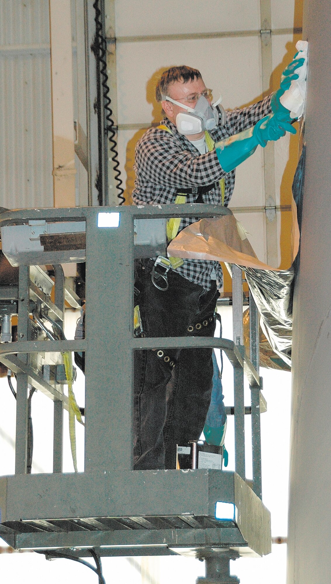 A 440th Airlift Wing maintainer prepares a C-130 tail to recieve the unit's new tail flash. The 440th AW, the Wisconsin based AF Reserve unit that will be moving to Pope in the next few months, has received approval for a new "tail flash" that will show off the unit's history and its new North Carolina home. (Courtesy photo)