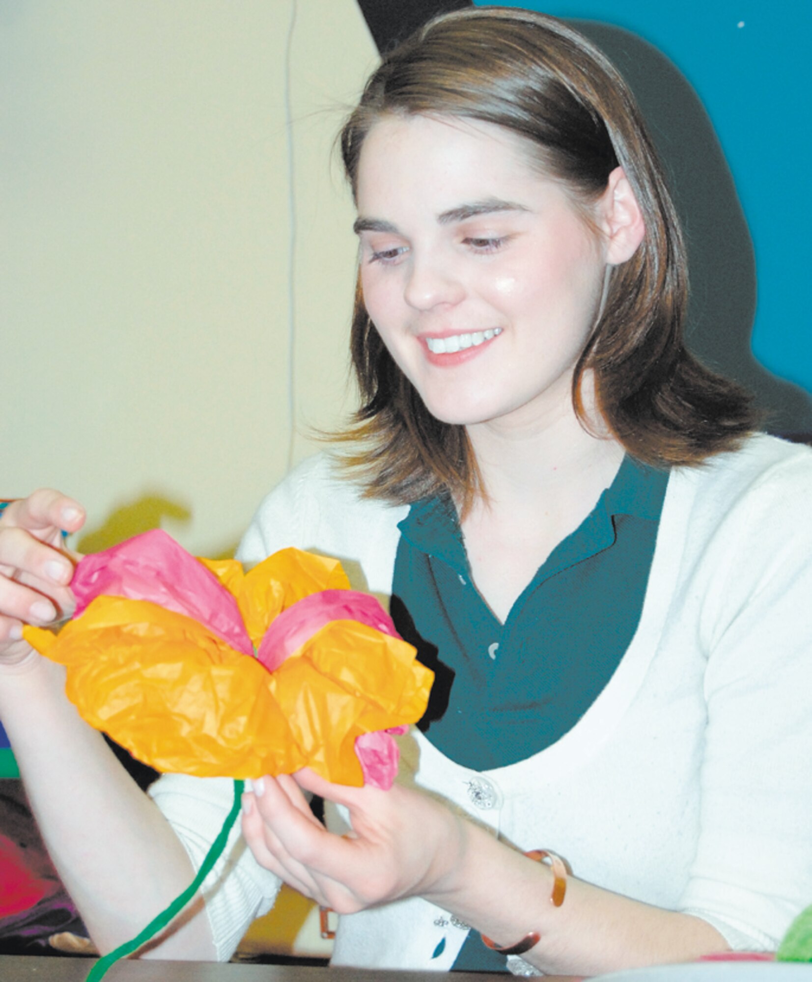 Brittany Willis, Pope's Youth of the Year recipient, makes a flower out of tissue paper. She enjoys working on crafts in her spare time, as well as other various activities.