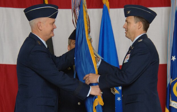 Col. Earl D. Matthews takes the 435th Air Base Wing guide-on from Lt. Gen. Rod Bishop, 3rd Air Force commander, during a change of command ceremony April 18 on Ramstein. Photo by Airman 1st Class Julianne Showalter.