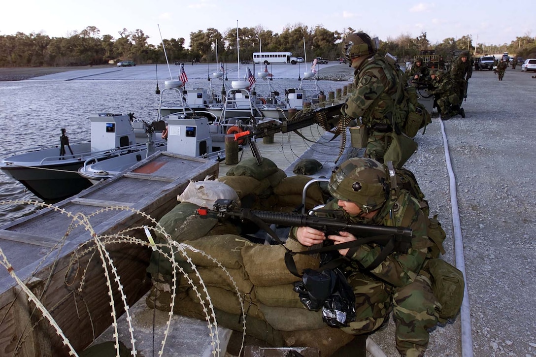 Members of U.S. Coast Guard Port Security Unit 311 clear their pier during training at Camp Lejeune, N.C., on March 5, 2001. Photo by Petty Officer 1st class Jim Hampshire, USN.