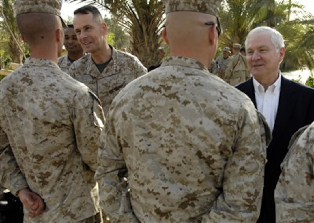 Chairman of the Joint Chiefs of Staff U.S. Marine Gen. Peter Pace and U.S. Defense Secretary Robert M. Gates meet with Marines at Camp Fallujah, Iraq, April 19, 2007.