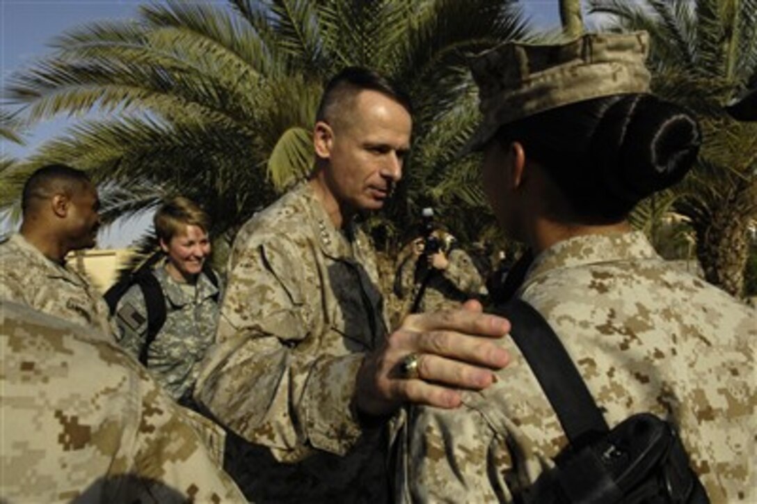 Chairman of the Joint Chiefs of Staff Gen. Peter Pace (left), U.S. Marine Corps, meets with Marines at Camp Fallujah, Iraq, on April 19, 2007.  Pace and Secretary of Defense Robert M. Gates are in Iraq to meet with Army Gen. David Petraeus, commander Multinational Force Iraq, Marine Maj. Gen. Walter Gaskin, Commander of Multinational Forces-Iraq West, Navy Adm. William Fallon, commander of U.S. Central Command, and Army Lt. Gen. Ray Odierno, commander Multinational Corps Iraq.  