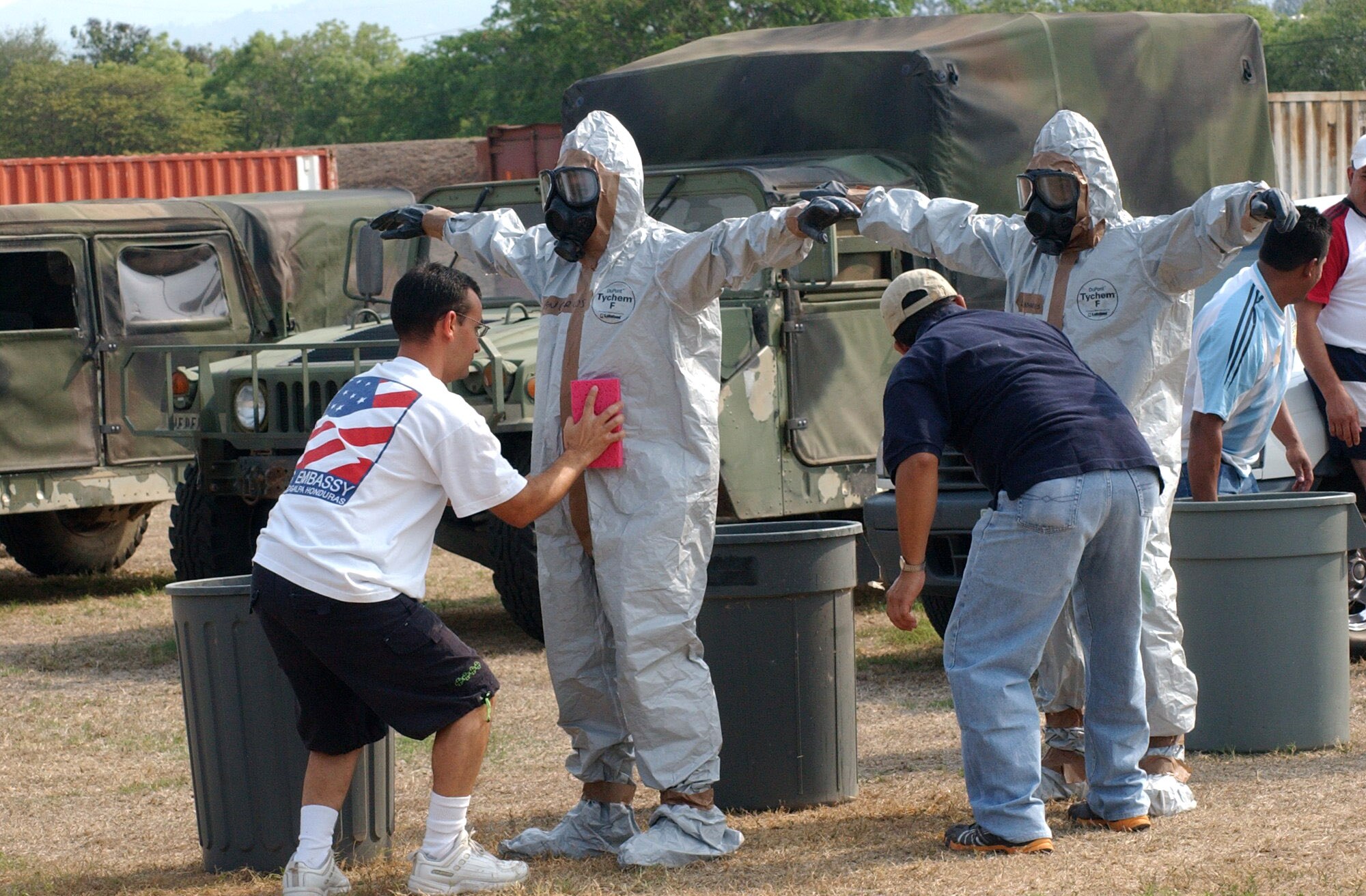 Abner Radillo and Erling Alvarez process their co-workers through a decontamination line following a major accident response exercise held April 17-19 at Soto Cano Air Base, Honduras. Thirty eight students attended the class, which provided training on first aid techniques and chemical, biological, radiological, nuclear, and explosive readiness training. Radillo is with U.S. Aid and Alvarez is from the U.S. Embassy. (U.S. Air Force photo/Tech. Sgt. Sonny Cohrs)