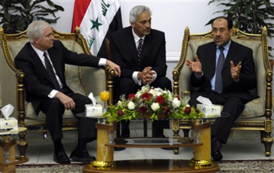 Defense Secretary Robert M. Gates speaks with Iraqi Prime Minister Nouri al-Maliki, right,  through a translator, center, in Baghdad, April 20, 2007.  Gates told reporters later that he is urging the Iraqi officials to speed up national reconciliation among the country’s  various factions in order to progress toward justice and reconciliation in Iraq. 