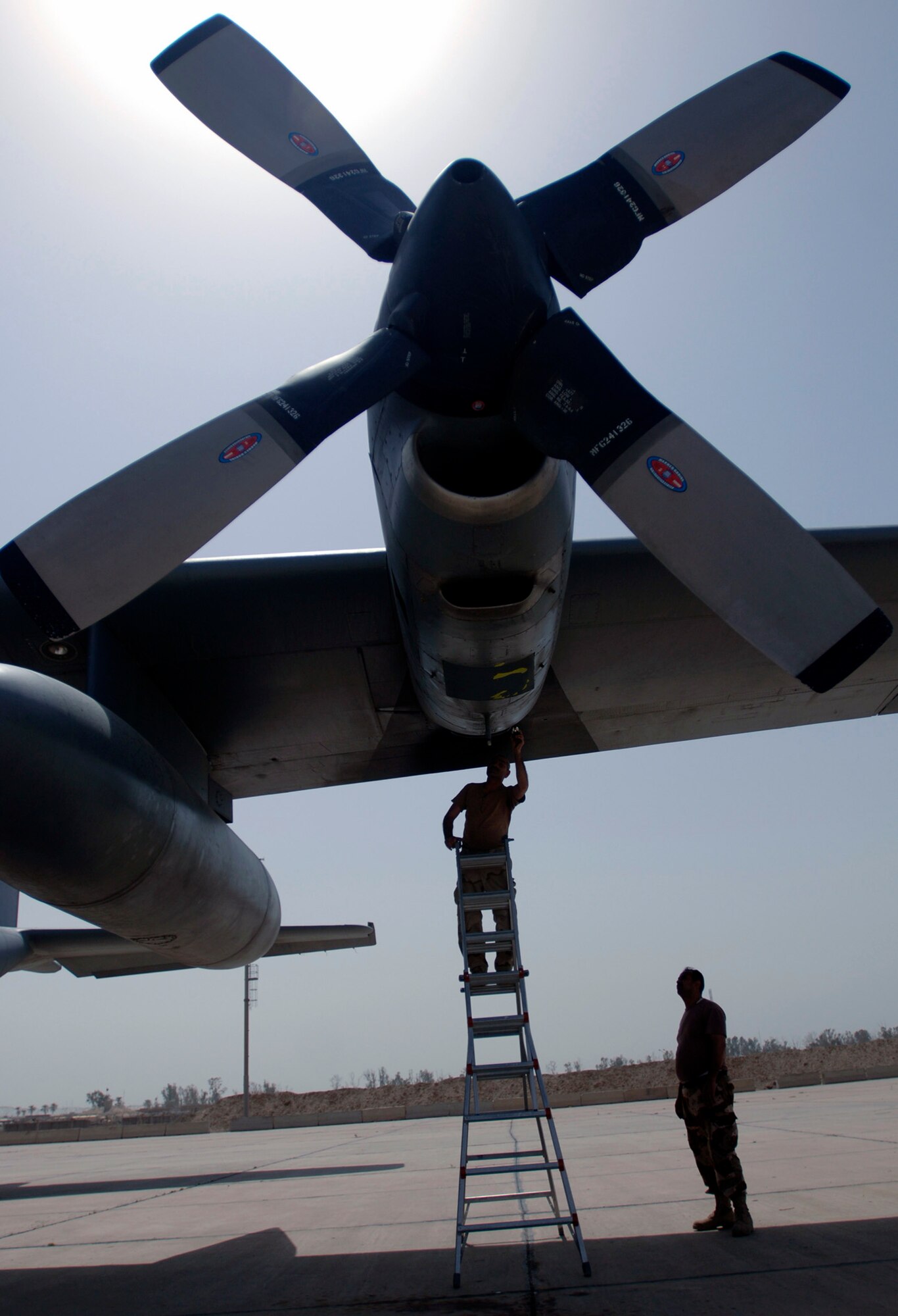 Iraqi Airmen repair an engine part on an Iraqi Air Force C-130 Hercules at New Al Muthana Air Base, Baghdad, Iraq.  The 370th Air Expeditionary Advisory Squadron on base provides guidance and mentoring in an effort to help restart the IAF.  (U.S. Air Force photo/Tech. Sgt. Cecilio M. Ricardo Jr.)