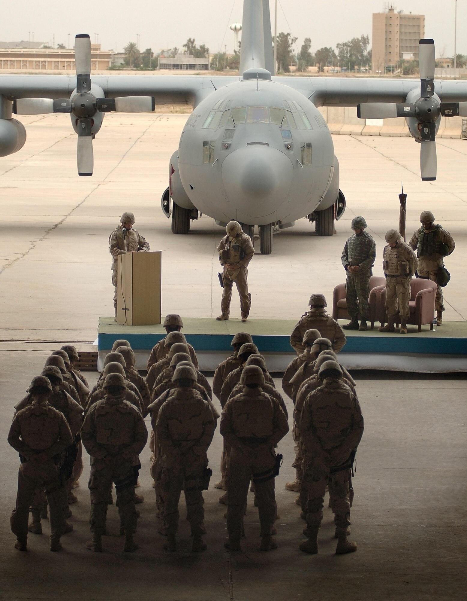 Baghdad, Iraq --Members of the 370th Air Expeditionary Advisory Group bow their heads in invocation during the Unit Activation ceremony of the 370th AEAG on New Al Muthana Air Base April 22.  (U.S. Air Force photo/Tech. Sgt. Cecilio M. Ricardo Jr.) 