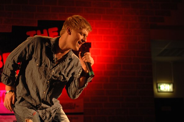 SPANGDAHLEM AIR BASE, GERMANY -- Anthony Fedorov, American Idol season four finalist, performs at Spangdahlem Air Base April 15. Mr. Fedorov is touring U.S. Air Forces in Europe bases this month promoting the kick-off of the USAFE Services Extreme Summer program. He is currently working on solo material with some of music's most successful songwriters and he found time to co-star as a celebrity judge in a MTV network original show. For more information about the Extreme Summer program, visit www.extremesummer.com. (Photos by Airman 1st Class Emily Moore) (US Air Force photo/Airman 1st Class Emily Moore)