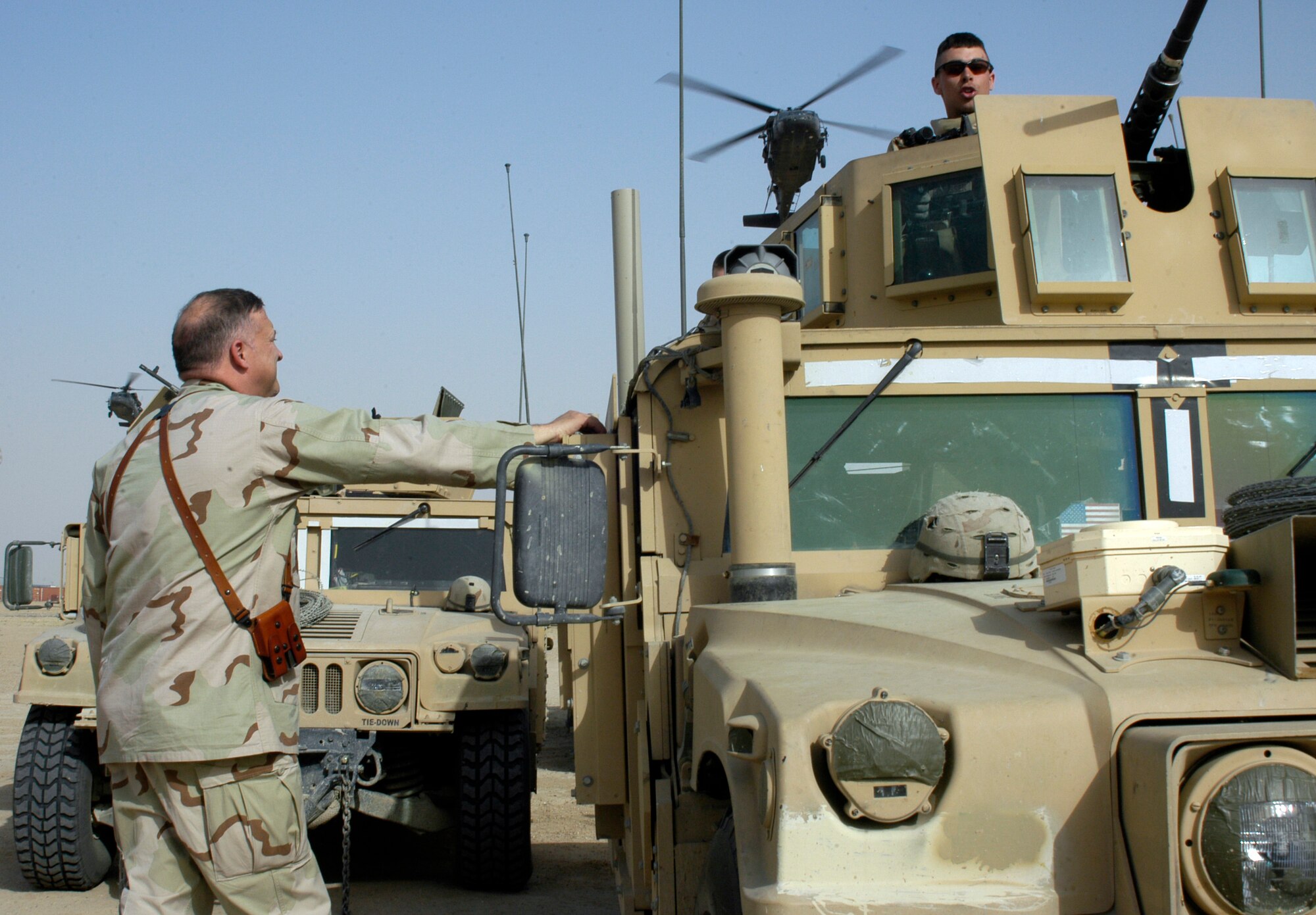 SOUTHWEST ASIA -- Lt. Gen. Gary North, CENTAF Commander, recieves a briefing from an Airman of the 586th Expeditionary Security Forces Squadron at Camp Bucca, Iraq on April 20, 2007. Camp Bucca is one of the many places in the CENTCOM AOR where Airmen are doing non-traditional jobs. (AF photo/Staff Sgt. Ian Carrier)                               