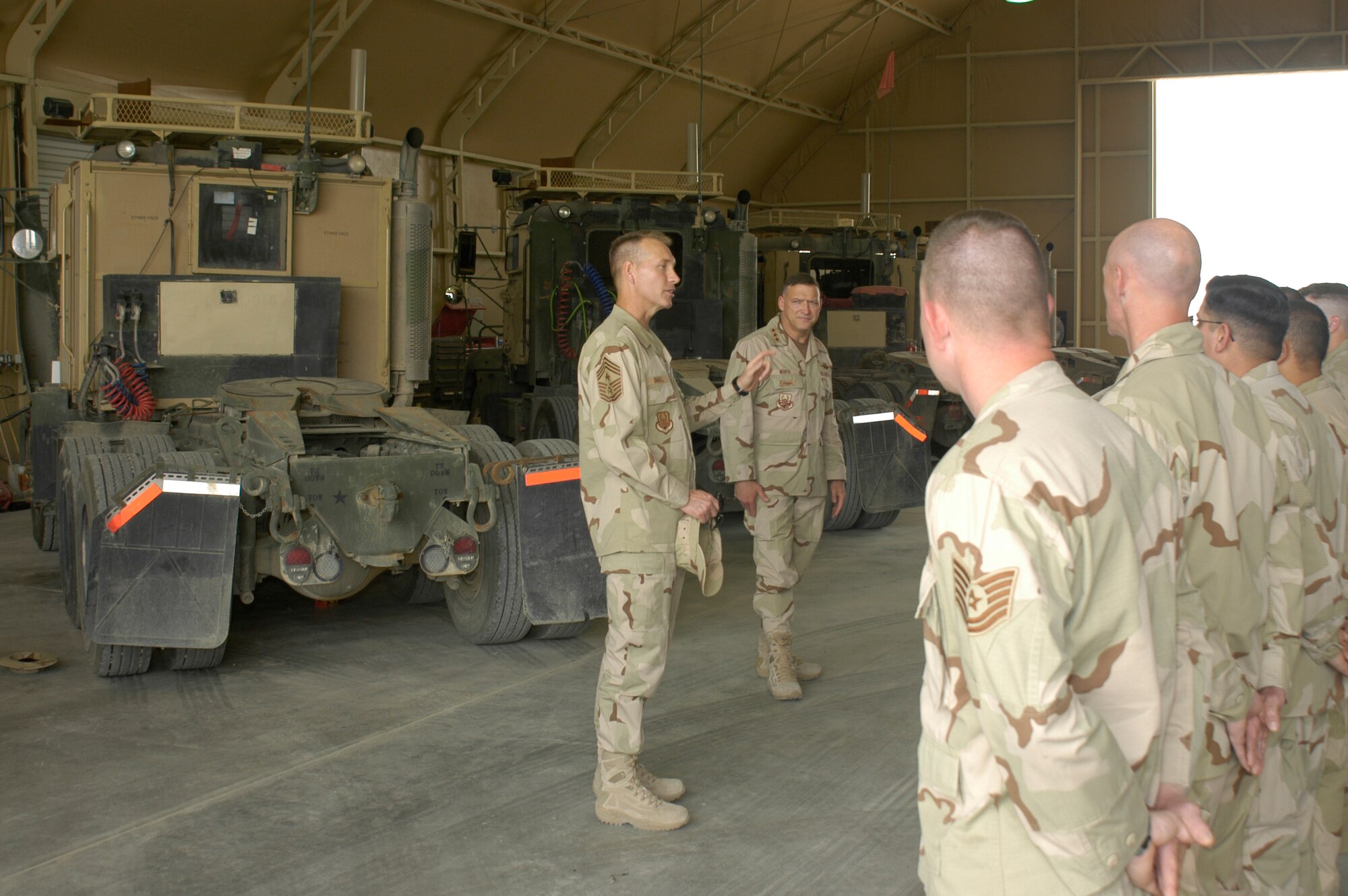 SOUTHWEST ASIA -- Chief Master Sgt. Richard Small, CENTAF Command Chief, and Lt. Gen. Gary North, CENTAF Commander, address members of the 586th Expeditionary Mission Support Group at Camp Arifjan. The 586th is one of the many units in the CENTCOM AOR where Airmen are doing non-traditional jobs. (AF photo/Staff Sgt. Ian Carrier)                             