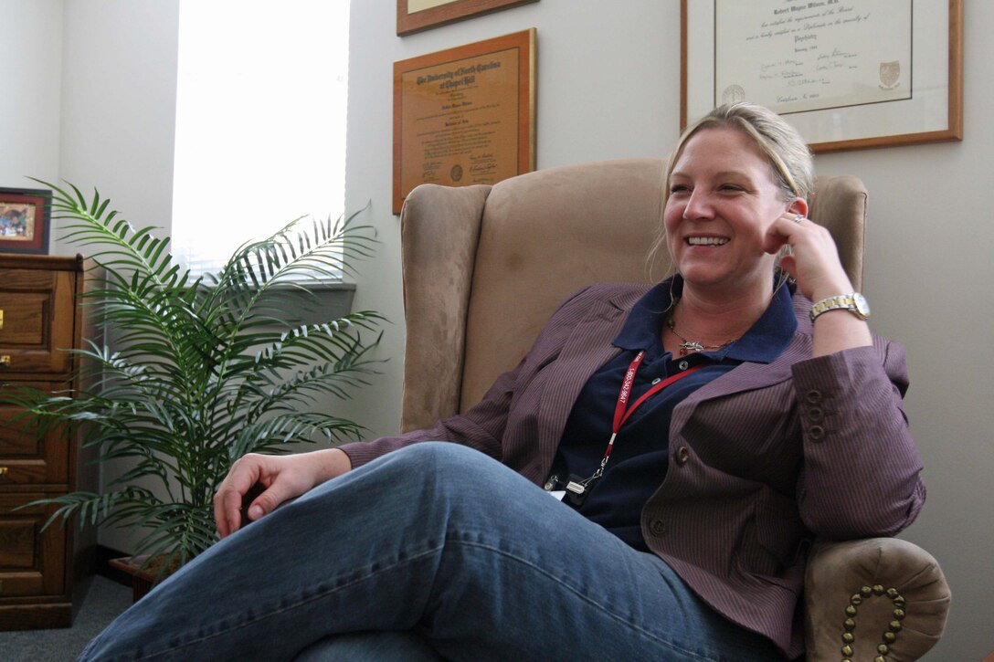 Sarah S. Spar-Alexander, a clinic psychologist, sits down to discuss the services provided by the Deployment Wellness Clinic aboard Marine Corps Base Camp Lejeune, N.C., June 23, 2011. Sarah S. Spar-Alexander works with to help Marines and sailors dealing with post traumatic stress disorder, anxiety and depression.