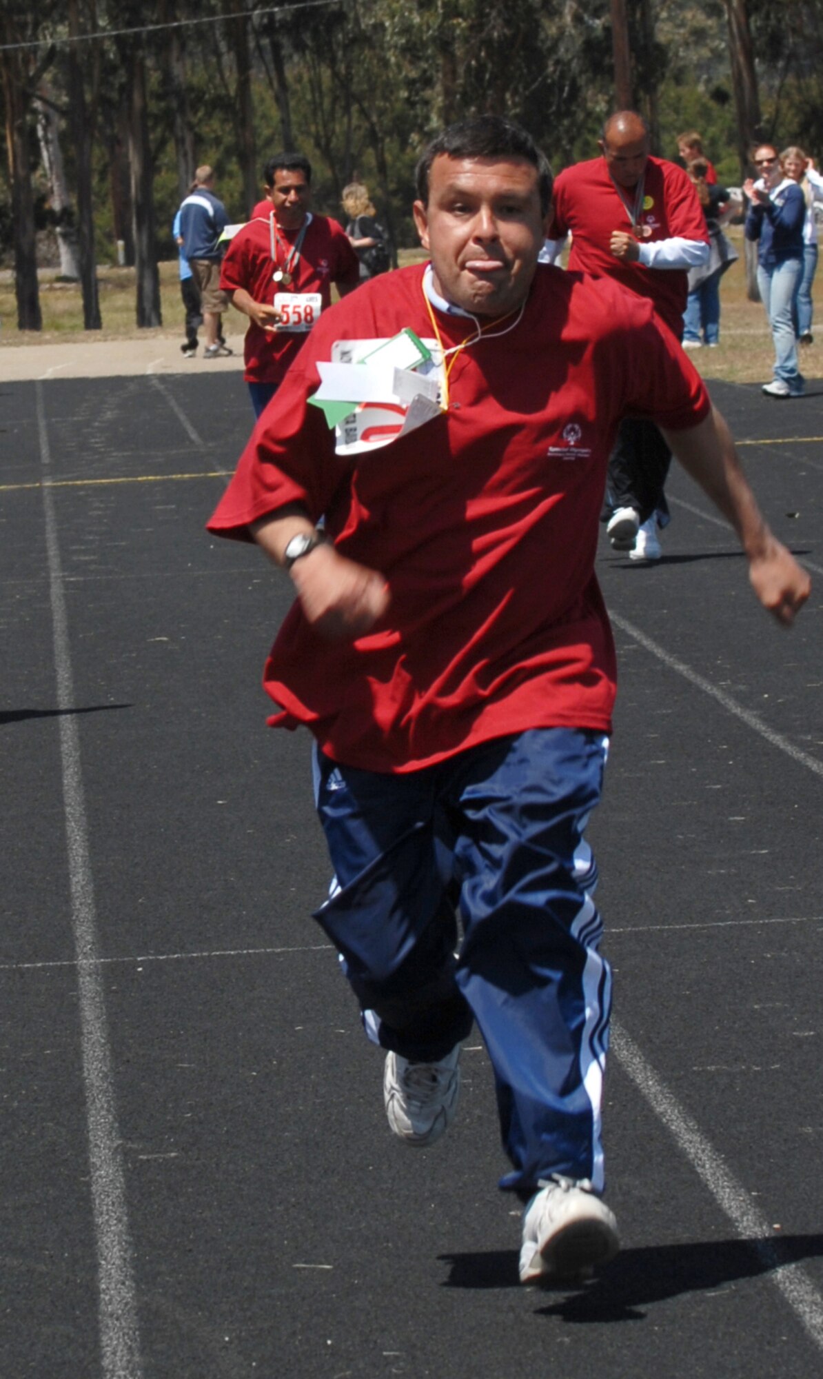 On his way to finish in first place, Ramare Ceja races during the 100-yard run at the Special Olympics held at the Vandenberg track April 21.  (Photo by Staff Sgt. Jamie Lessard)