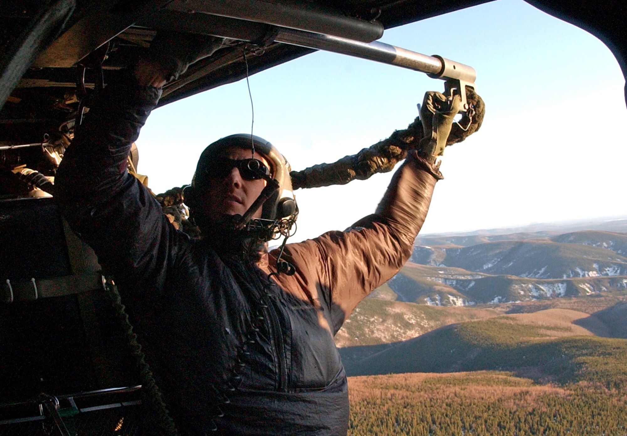 Pararescuemen Tech. Sgt. Bobby Schnell prepares to fast rope out of an HH-60G Pave Hawk helicopter April 17 at Eielson Air Force Base, Alaska. Sergeant Schnell is with the 210th Rescue Squadron Det. 1 as part of a combat search and rescue mission during Red Flag-Alaska 07-1. (U.S. photo/Senior Airman Justin Weaver)