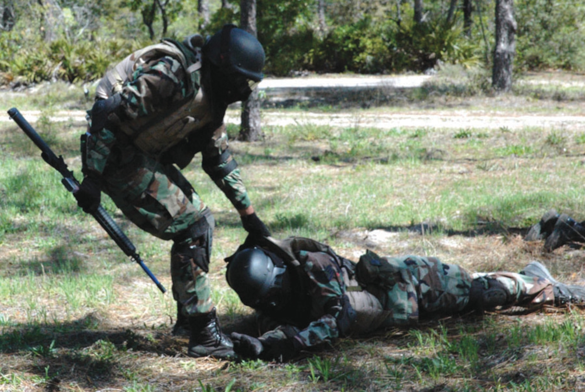 An Airman transports a wounded comrade to a safe location during a combat training scenario at ECST. The students received self aid and buddy care training as part of the course. (U.S. Air Force photo by 2nd Lt. Lauren Johnson)