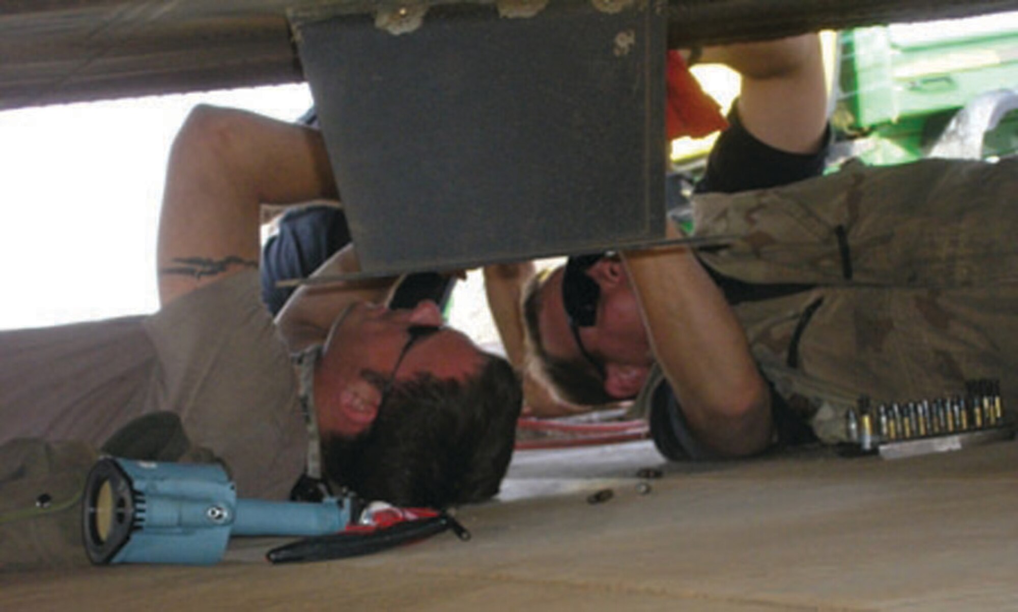 Two 1st Special Operations Maintenance Group Airmen perform aircraft battle damage repair to a plane in a deployed location. The 1st SOMXG celebrated a successful year of high operations deployments, vigorous training and test missions. (Courtesy photo)