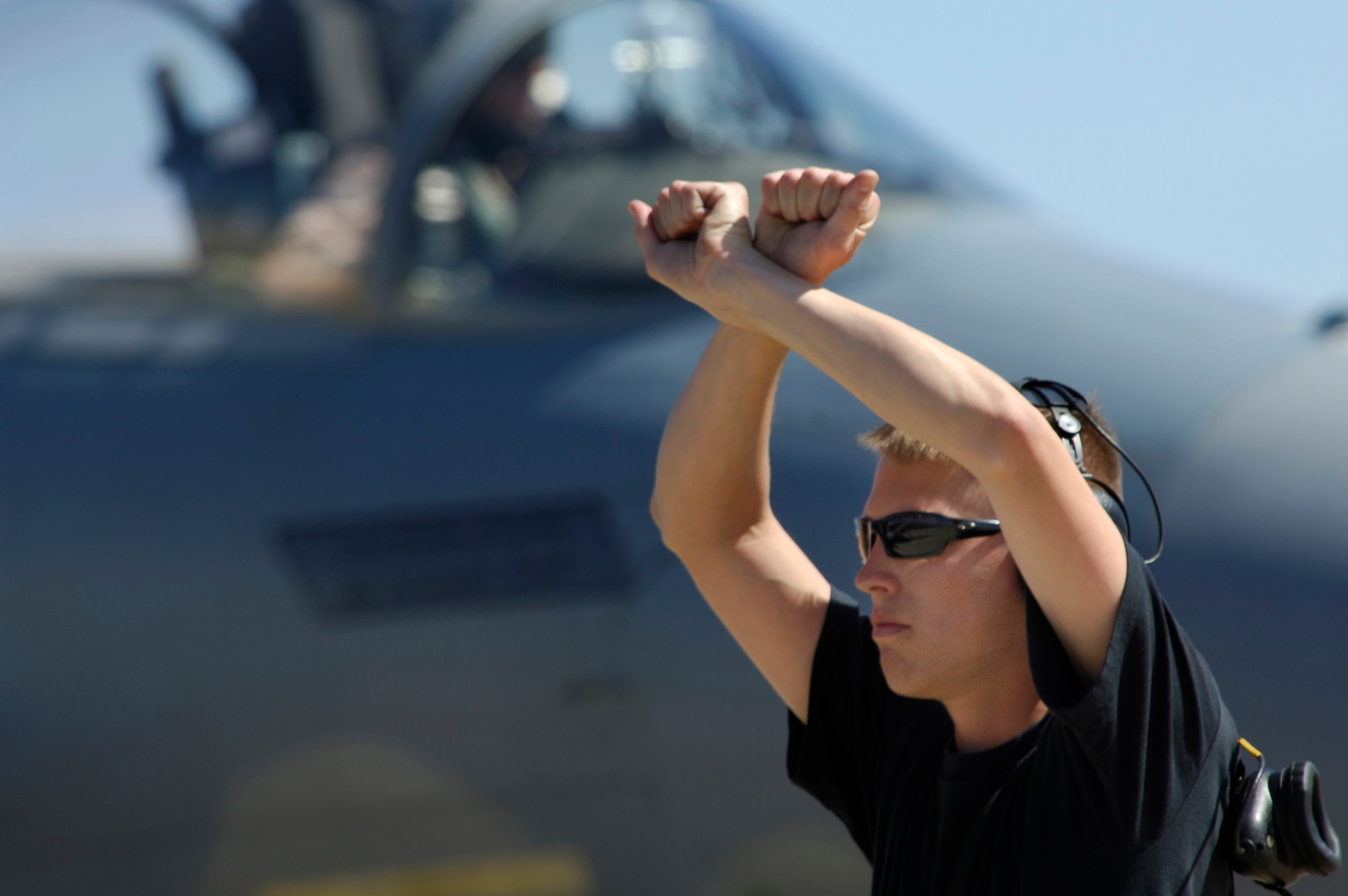 Airman 1st Class Ryan Walsh, a dedicated crew chief with the 71st Fighter Squadron, marshals an F-15 Eagle from the 71st into position April 22. The 71st Fighter Squadron deployed to Exercise Iron Eagle, a joint multi-national exercise designed to provide intense training in a realistic combat environment. (U.S. Air Force Photo/Staff Sgt. Samuel Rogers)