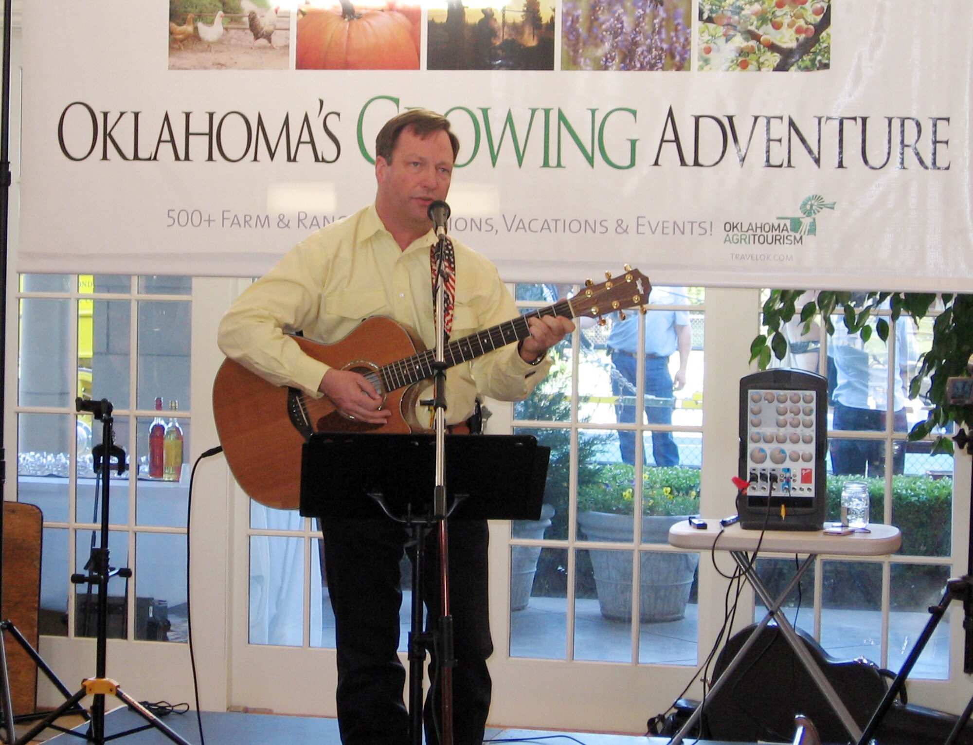 Ken Girty,T-6 scheduled maintenance senior mechanic, Computer Services Corporation, at Vance Air Force Base, plays “Oklahoma Rising”, the new state centennial celebration song written by Vince Gill and Jimmy Webb, at the Agriculture and Tourism Convention in Oklahoma City April 18. In addition to working at Vance for 11 years, he also serves as Senior Master Sgt. Girty, first sergeant for the 18th Air Refueling Squadron at McConnell AFB, Kan. The convention where he appeared as guest artist was slated by state legislators to bring the two areas of the state’s commerce together in a program targeted at increasing areas of tourism. (Photo courtesy of Laura Girty)