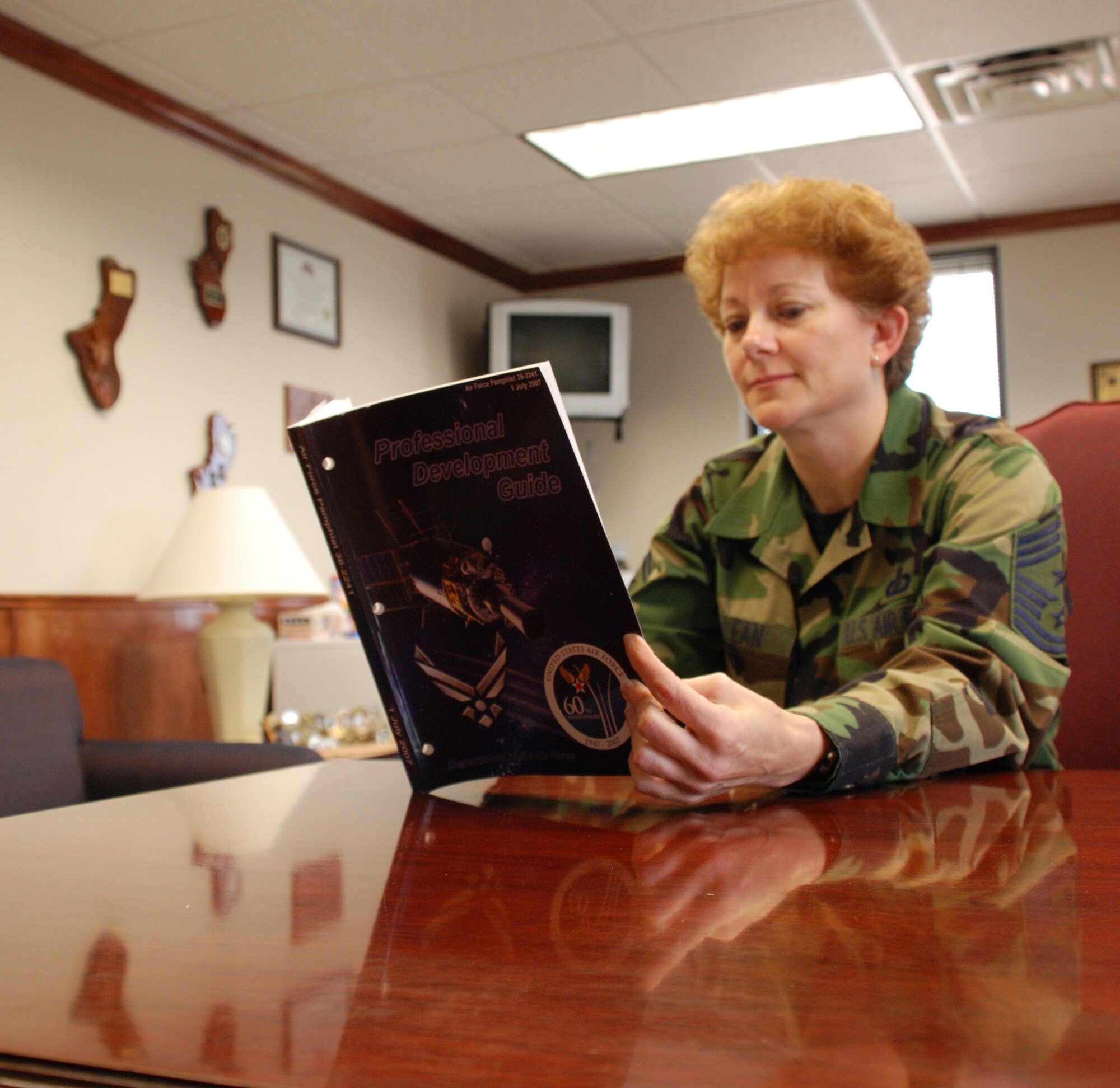 Chief Master Sgt. Jeannie McLean, 82nd Training Wing command chief, reviews the new professional development guide April 19. (U.S. Air Force photo/Airman 1st Class Jacob Corbin)