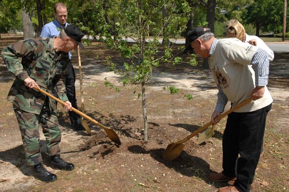 SHAW AIR FORCE BASE, S.C. -- Col. Francis Xavier, 20th Mission Support Group commander, and members of the local community plant a red maple sapling as part of an Earth Day observance April 20. The base-wide Earth Day program, "Keep Shaw AFB Clean," raised environmental concerns to encourage cleaner daily practices. In addition to the tree planting ceremony, other events included a base-wide cleanup and an electronic waste turn-in. (U.S. Air Force photo by Staff Sgt. Josef E. Cole III)