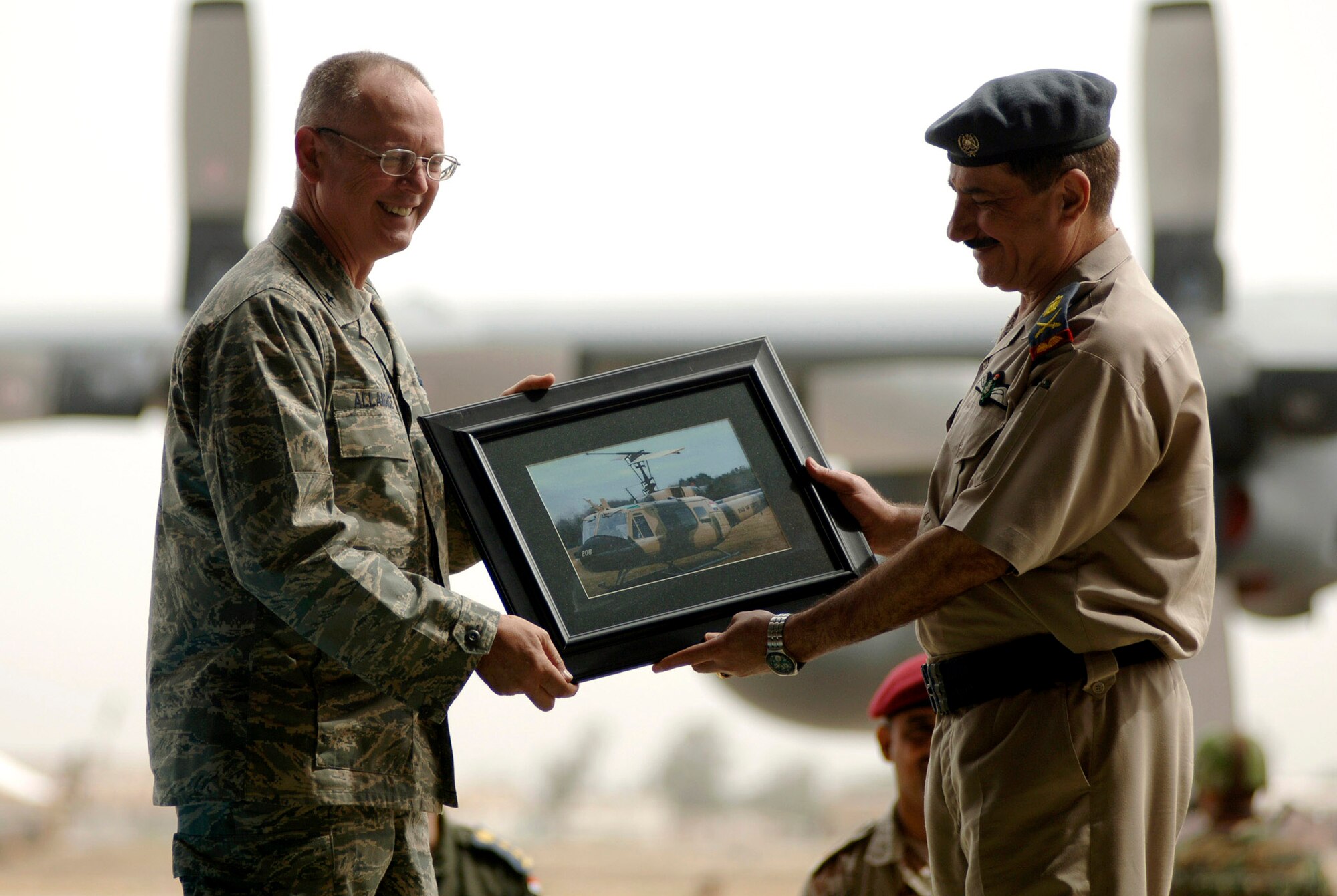 Brig. Gen. Robert R. Allardice presents Brig. Gen. Abdul Kareem, the New Al Muthana Air Base commander with a gift of appreciation April 22 during the celebration of the 76th anniversary of the Iraqi air force at the New Al Muthana AB in Baghdad, Iraq. (U.S. Air Force photo/Tech. Sgt. Cecilio M. Ricardo Jr.)
