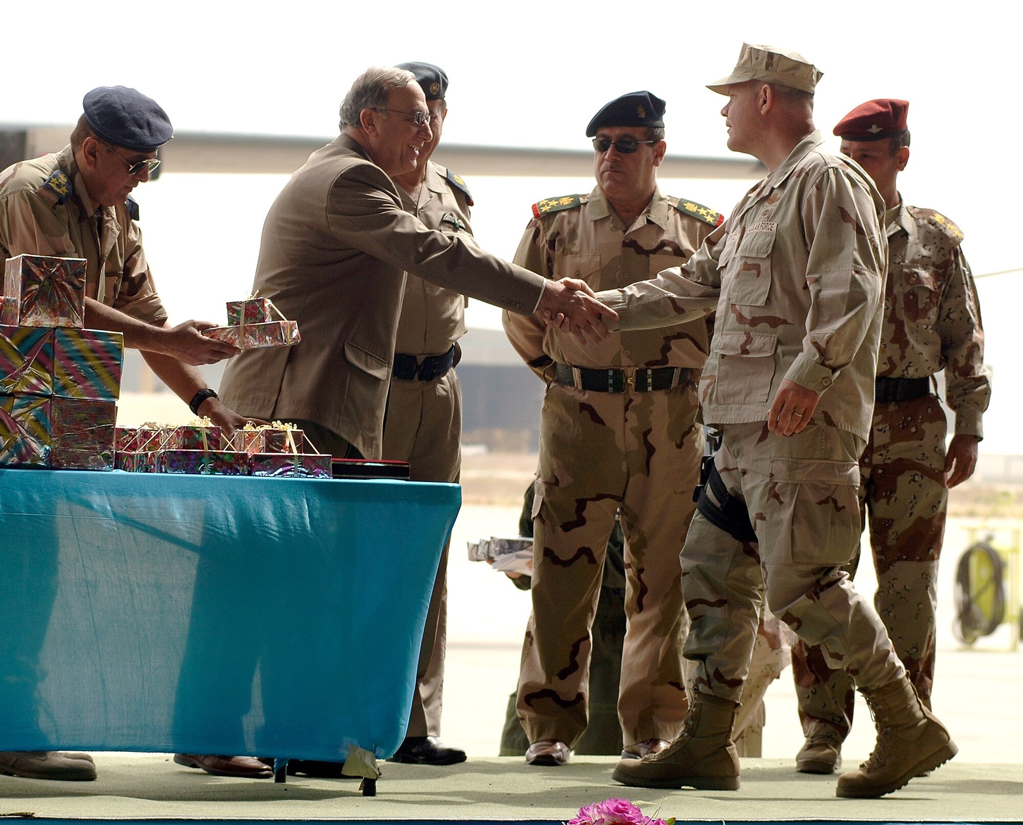 Iraqi Minister of Defense Abd al-Qadir al-Mufriji presents Col. Mark Schmitz with a gift April 22 during the celebration of the 76th anniversary of the Iraqi air force at the New Al Muthana Air Base Air Base in Baghdad, Iraq. (U.S. Air Force photo/Tech. Sgt. Cecilio M. Ricardo Jr.)