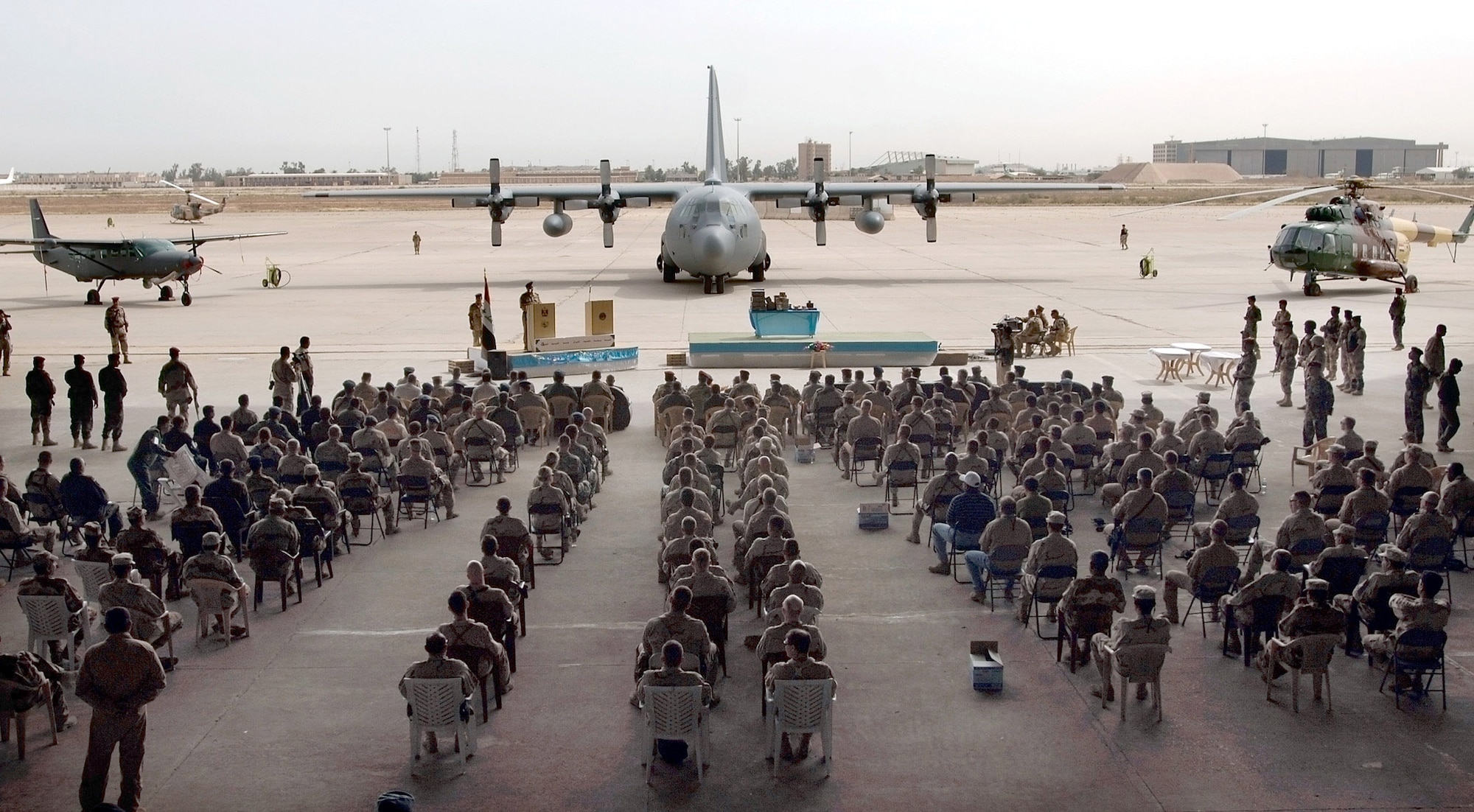 Approximately 100 distinguished visitors, guests, and Iraqi and U.S. servicemembers gather April 22 to commemorate the 76th anniversary of the Iraqi Air Force at the New Al Muthana Air Base in Baghdad, Iraq. (U.S. Air Force photo/Tech. Sgt. Cecilio M. Ricardo Jr.)