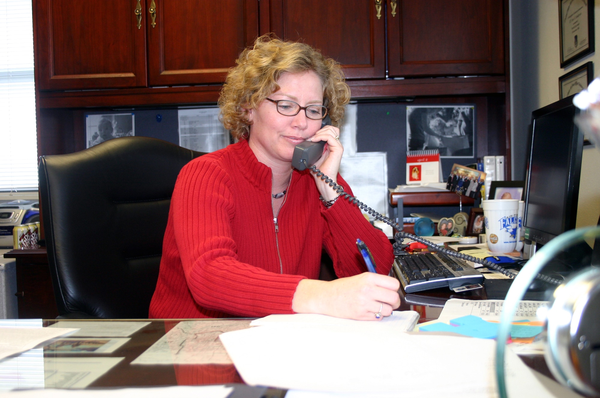 Special Agent Amy Bumgarner, commander of the OSI detachment at Sheppard, takes a call.  Agent Bumgarner recently won the Lance P. Sijan Award, Senior Officer category, for 2006. (U.S. Air Force photo/Staff Sgt. Tonnette Thompson)