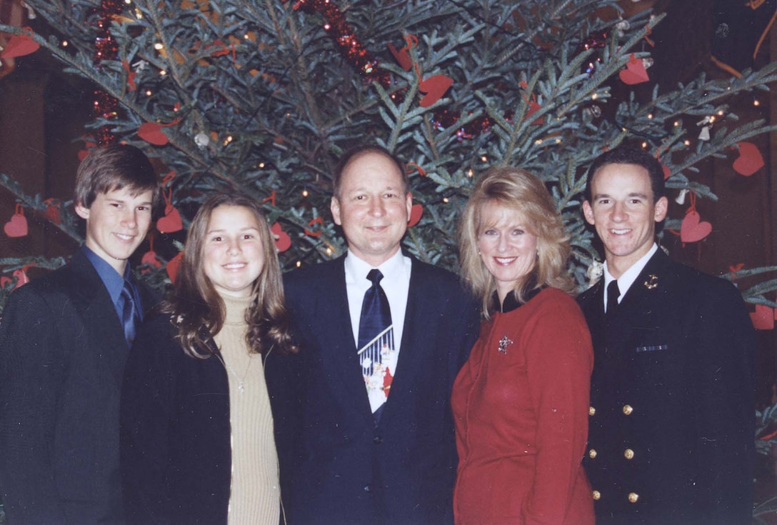 The Pasko family had a lot to celebrate on Christmas 2001. Father, Navy Capt. John Pasko, was well on the way to recovery following an unusual, life-saving, live-donor lung transplant operation in Los Angeles in July. The Paskos (from left) are son Dan, daughter Kaitlyn, Pasko, wife Sherry, and son Joseph, a Naval Academy midshipman. Photo courtesy the Pasko family. 