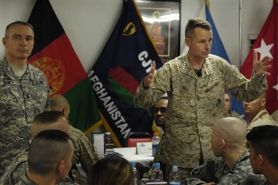 Chairman of the Joint Chiefs of Staff U.S. Marine Gen. Peter Pace (right) and Senior Enlisted Advisor to the Chairman of the Joint Chiefs of Staff Command Sgt. Maj. William Gainey speak with and take questions from the troops stationed in Bagram, Afghanistan, April 21, 2007. 