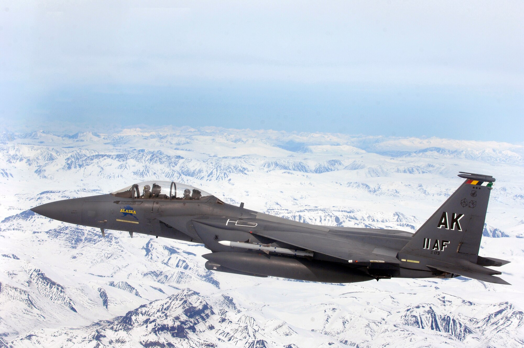 OVER ALASKA -- An F-15E Strike Eagle flys over glacial fields during a training mission. The Strike Eagle is assigned to the 90th Fighter Squadron at Elmendorf Air Force Base, Alaska, which traces its history back to August 1917. Another chapter in that rich history is about to be written as the F-15E at Elmendorf will soon be replace by the F-22A Raptor. (U.S. Air Force photo by Tech. Sgt. Keith Brown)