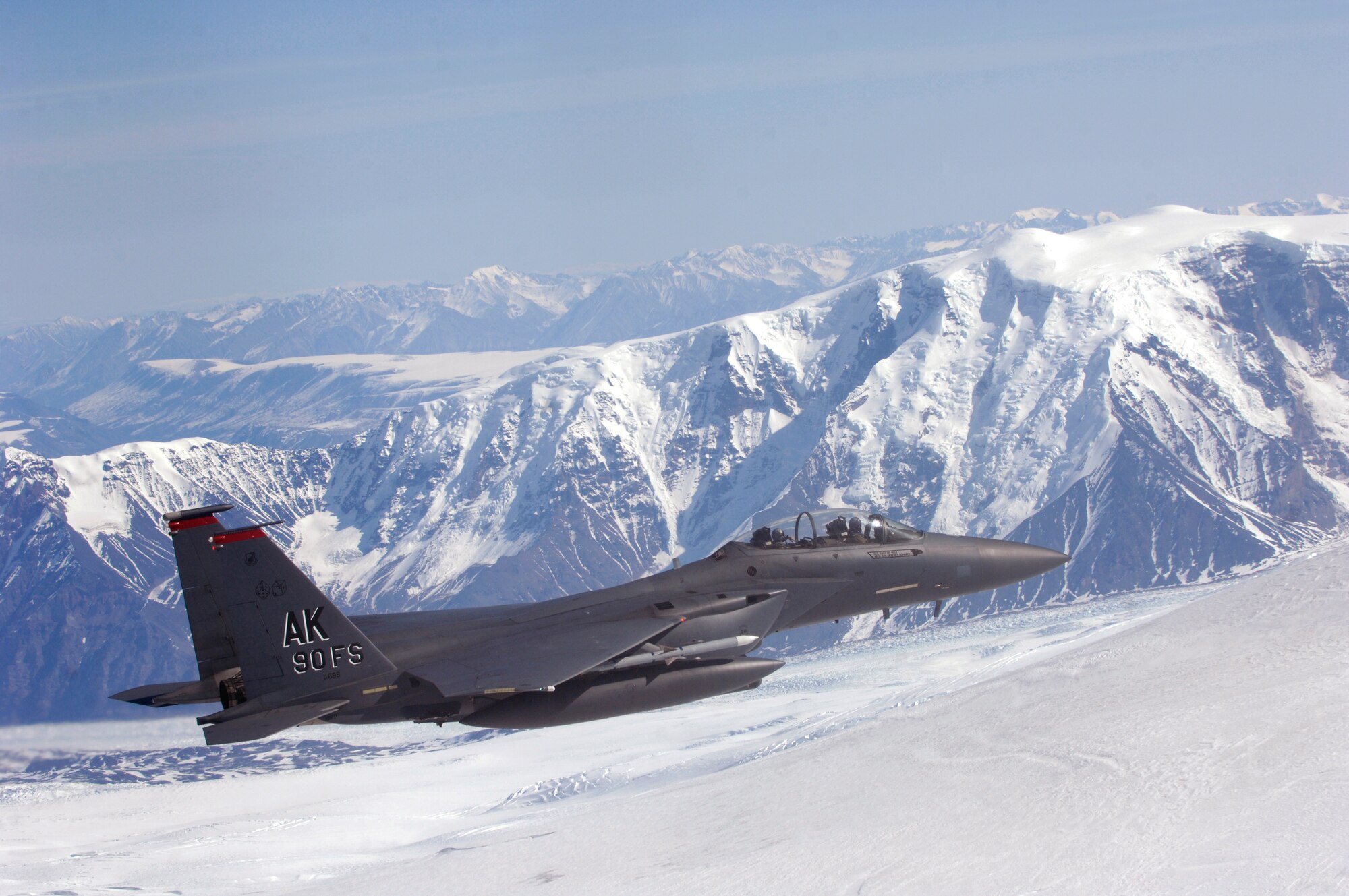 OVER ALASKA -- An F-15E Strike Eagle flys along the Wrangell/St.Elias Mountain Range during a training mission. The Strike Eagle is assigned to the 90th Fighter Squadron at Elmendorf AFB, Alaska, which traces its history back to August 1917. Another chapter in that rich history is about to be written as the F-15E at Elmendorf will soon be replace by the F-22A Raptor. (U.S. Air Force photo by Tech. Sgt. Keith Brown)
