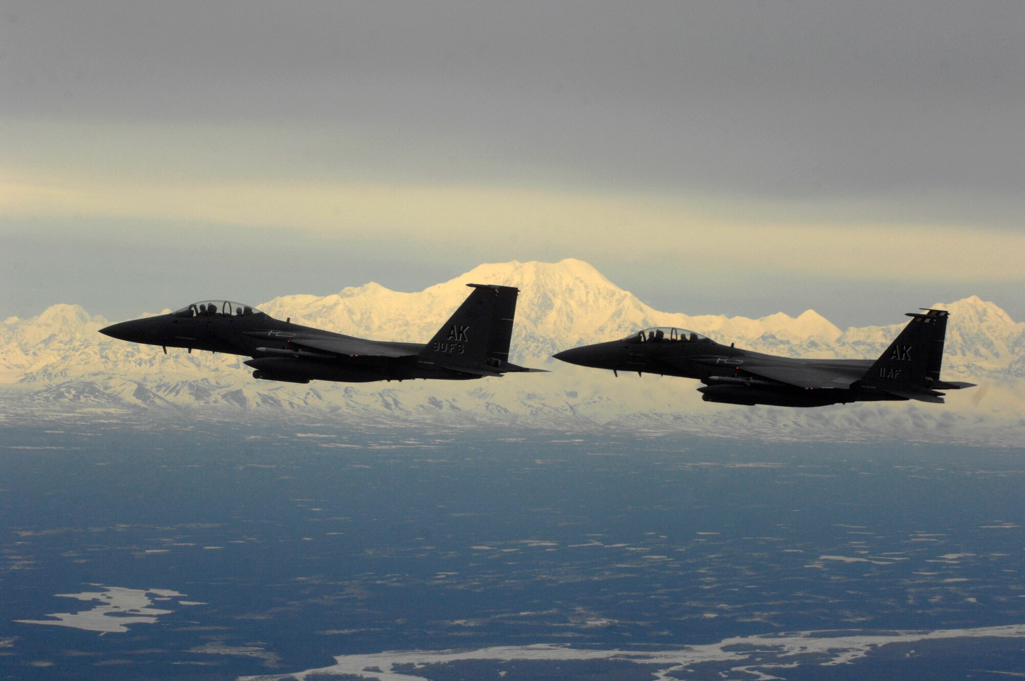 OVER ALASKA -- Two F-15E Strike Eagles head back to Elmendorf Air Force Base, Alaska, with Mount McKinley and the rest of the Alaska Mountain Range in the background. (U.S. Air Force photo by Tech. Sgt. Keith Brown)