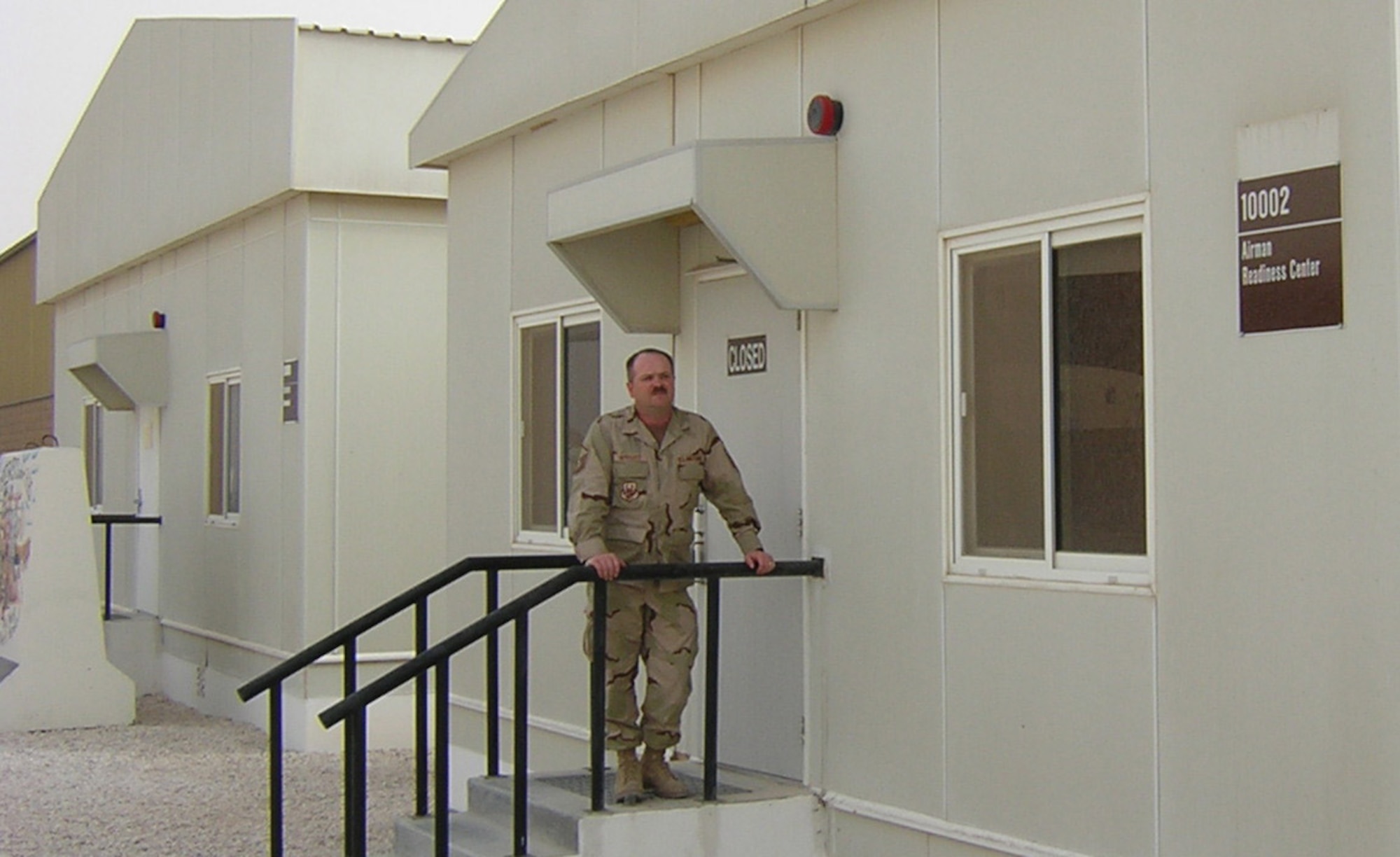 SOUTHWEST ASIA -- Ready for business: Master Sgt. Steven Wright stands outside the Air Force’s first Airman Readiness Center at his base in Southwest Asia. The sergeant recently deployed from Mountain Home Air Force Base to establish the readiness center to help military troops stationed in the region. Air Force photo