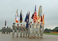 The Color Guard displays its flags during Pass and Review April 22 at the Fort Sam Houston Fiesta Parade at Fort Sam Houston. The Pass and Review is a traditional ceremony in which soldiers demonstrate their leadership qualities. Brig. Gen. Darrell and Holly Jones, Col. Eric and Mary Wilbur, and Chief Master Sgt. Dwayne and Veronica Hopkins, 37th Training Wing commander, vice-command and command chief, and their wives, respectively, represented Lackland Air Force Base, Texas, at the parade. Fiesta is a 10-day event with more than 100 scheduled events designed to honor the heroes of the Alamo and the Battle of San Jacinto. (USAF photo by Alan Boedeker)                               