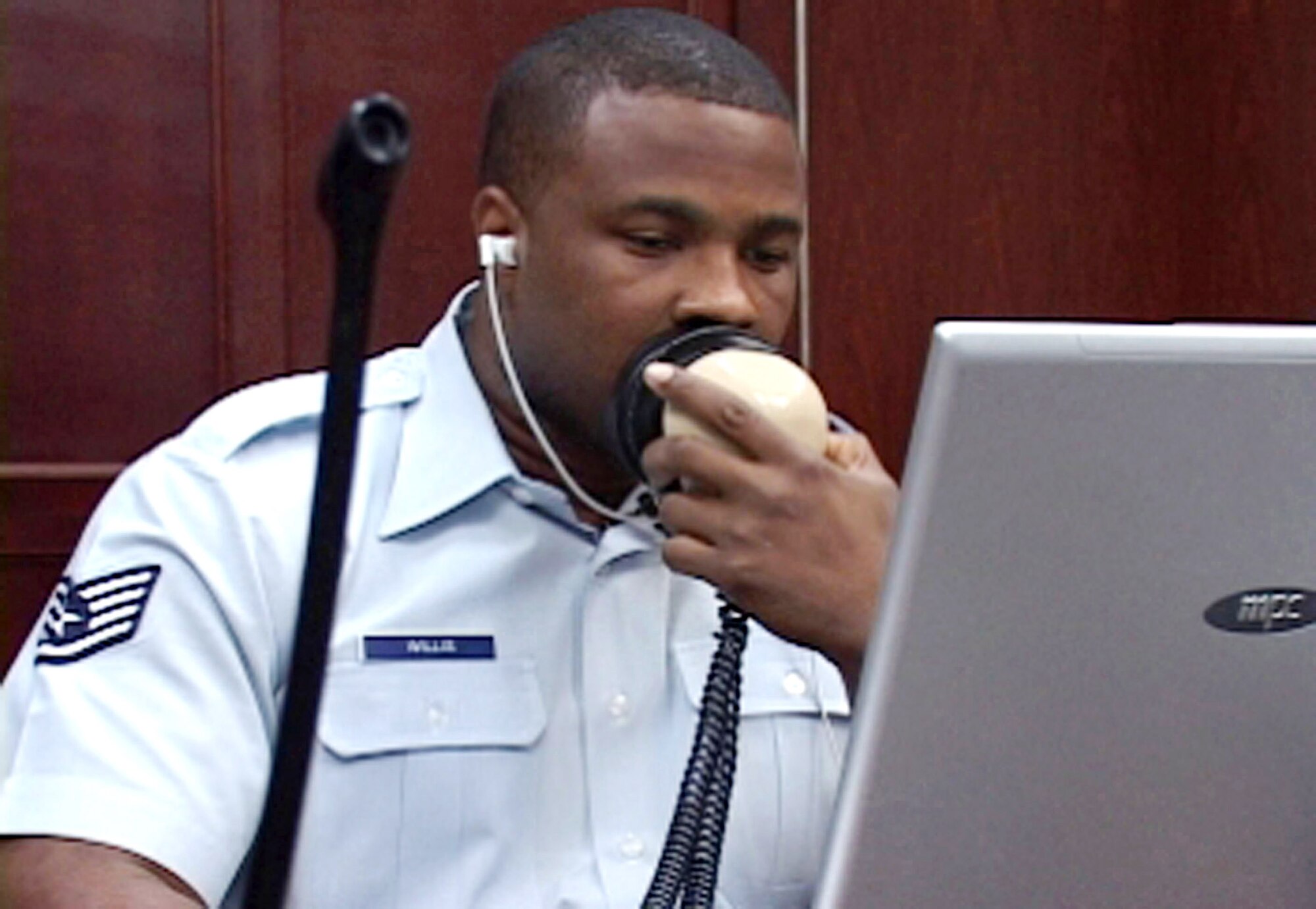 Staff Sgt. Antonia Willis repeats what is said during a court martial into a voice recognition program April 20 at Yokota Air Base, Japan. He is an enlisted court reporter and documents everything that is said and done during trials. (U.S. Air Force photo/Senior Airman Gena Armstrong)