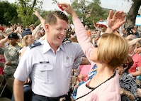 Col. Eric and Mary Wilbur engage in the Mexican tradition of breaking cascarones, or confetti-filled eggs, over one another's heads during the opening ceremony of Fiesta April 20 at the Alamo Plaza. Although there are several accepted meanings behind the breaking of a cascarone, the most common ones are to bring that person good luck, to bestow blessings upon a person or to indicate you have an admirer. Fiesta is a 10-day event with more than 100 scheduled events designed to honor the heroes of the Alamo and the Battle of San Jacinto. Colonel Wilbur is the vice commander of the 37th Training Wing at Lackland Air Force Base, Texas. (USAF photo by Robbin Cresswell)