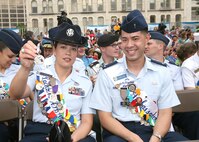 While enjoying the opening ceremonies of Fiesta on April 20, Lackland Ambassador Tech. Sgt. Magdalena Cortez of the 737th Training Group shows off a Fiesta medal. Both Sergeant Cortez and Capt. Brent Dishman, the other Lackland Ambassador, give out and exchange medals during the event. Fiesta is a 10-day event with more than 100 scheduled events designed to honor the heroes of the Alamo and the Battle of San Jacinto. Captain Dishman is assigned to the 37th Training Wing at Lackland Air Force Base, Texas. (USAF photo by Robbin Cresswell)