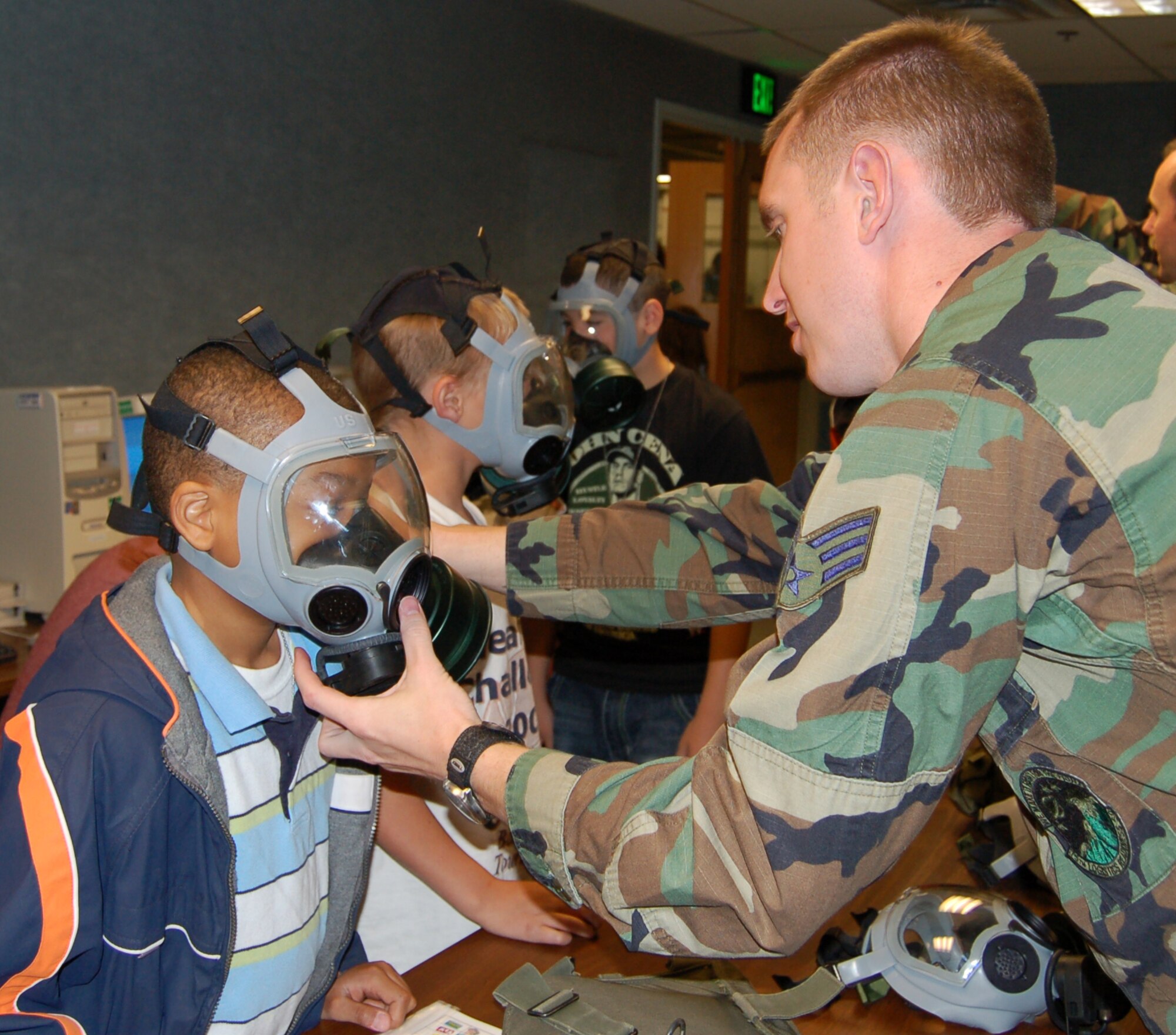 Attendees of Kid's Deployment Day had the chance to try gas masks, cold weather gear and other things their military parents use on deployments. Photos by Beth Young