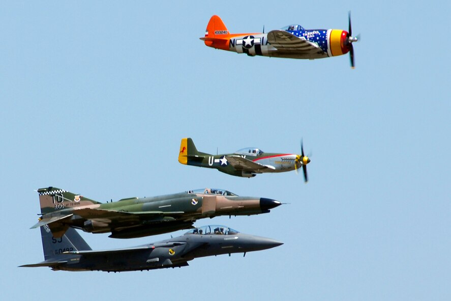 The U.S. Air Force Heritage flight consisting of a P-47 Thunderbolt, P-51 Mustang, F-4 Phantom and F-15 Strike Eagle, fly in formation past the crowd during Saturday's show.