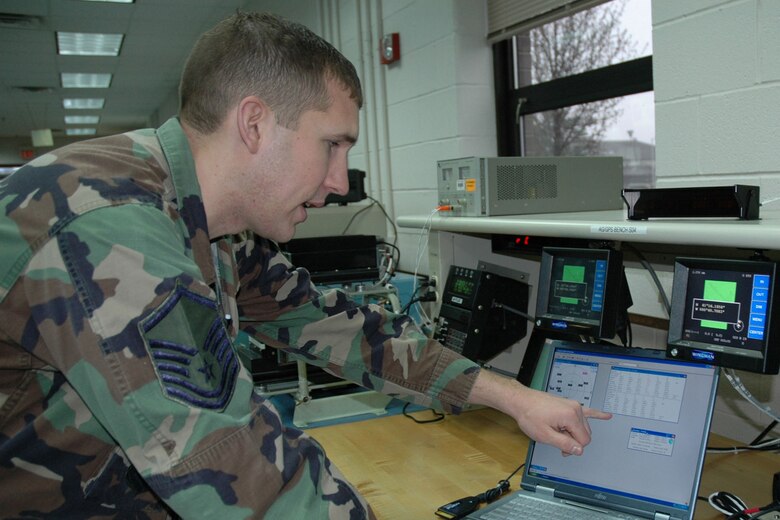 YOUNGSTOWN AIR RESERVE STATION, Ohio — Air Force Reserve Master Sgt. Michael Birmingham, an avionics technician in the 910th Aerial Spray Maintenance Flight, works on a laptop to locate satelites utilized by a new Global Positioning System being tested to replace the units currently used in the 910th's Aerial Spray aircraft. The new GPS units being tested by the Avionics Flight are part of a $2.6 million upgrade in the equipment used in Aerial Spray operations.  U.S. Air Force Photo/Tech Sgt. Bob Barko Jr.  