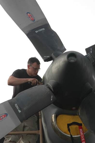 Senior Airman Michael Linke, a Dyess crew chief deployed with the 746th Aircraft Maintenance Unit, performs a post-flight inspection of a C-130 Hercules April 19. The 746th EAS was named the top airlift squadron in AMC. (U.S. Air Force photo/Senior Airman Erik Hofmeyer )
