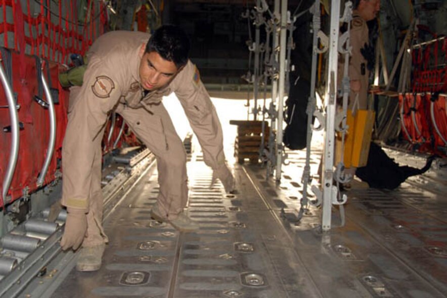 Airman 1st Class Angel Sanchez, a Dyess loadmaster deployed with the 746th Expeditionary Airlift Squadron, configures a C-130 Hercules for an aeromedical evacuation mission April 18. The 746th EAS was named the top airlift squadron in AMC. (U.S. Air Force photo/Airman 1st Class Gustavo Gonzalez)